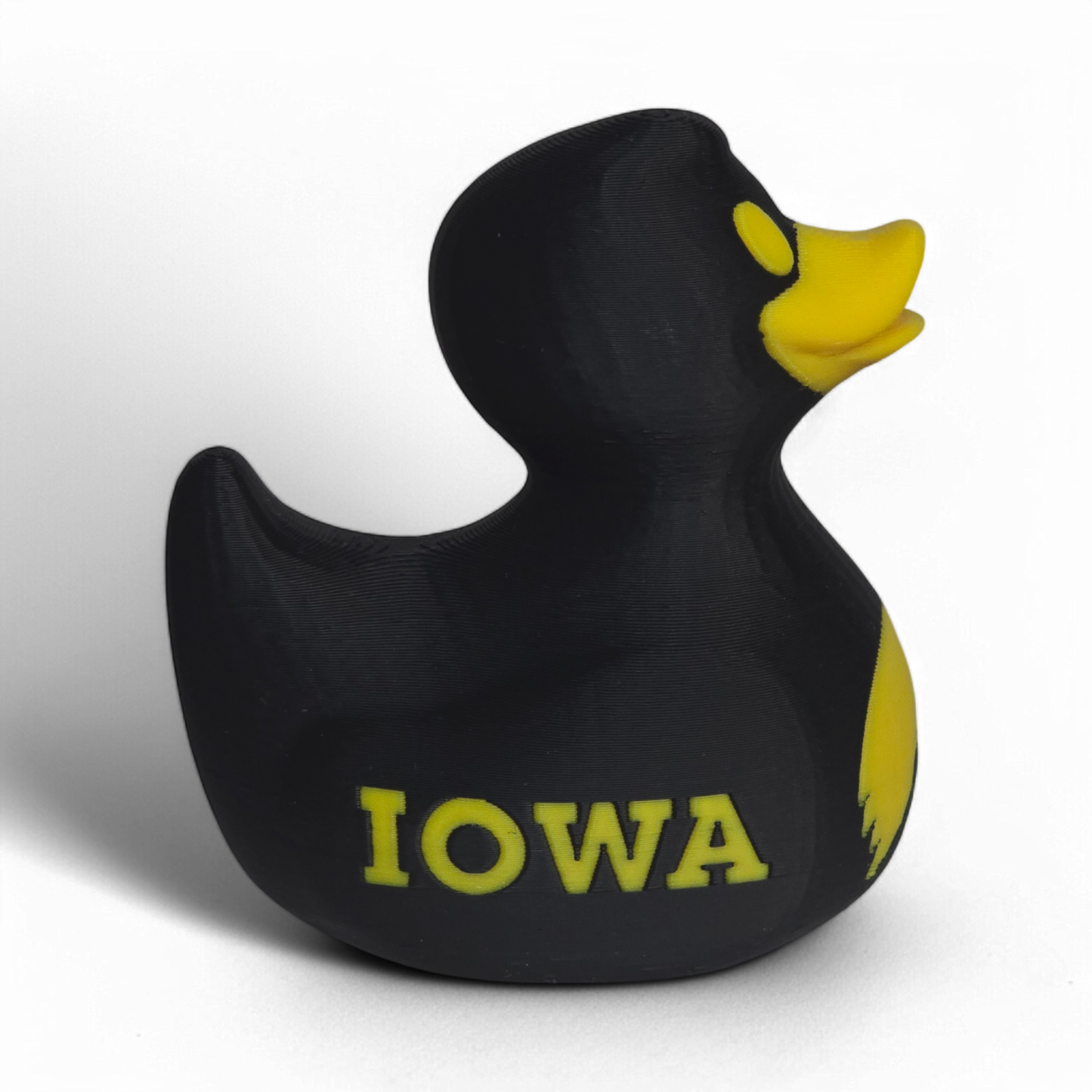 A black 3D printed PLA duck with a yellow beak, yellow eye, and yellow 'IOWA' lettering on the side, shown against a plain white background.