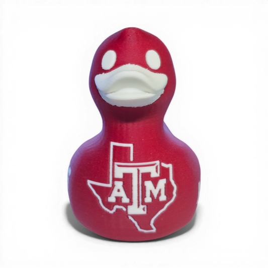 Red 3D printed PLA duck with Texas A&M logo on a white background