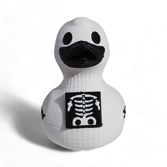 White 3D printed PLA duck with black skeleton design and 'X-Ray' text on a white background