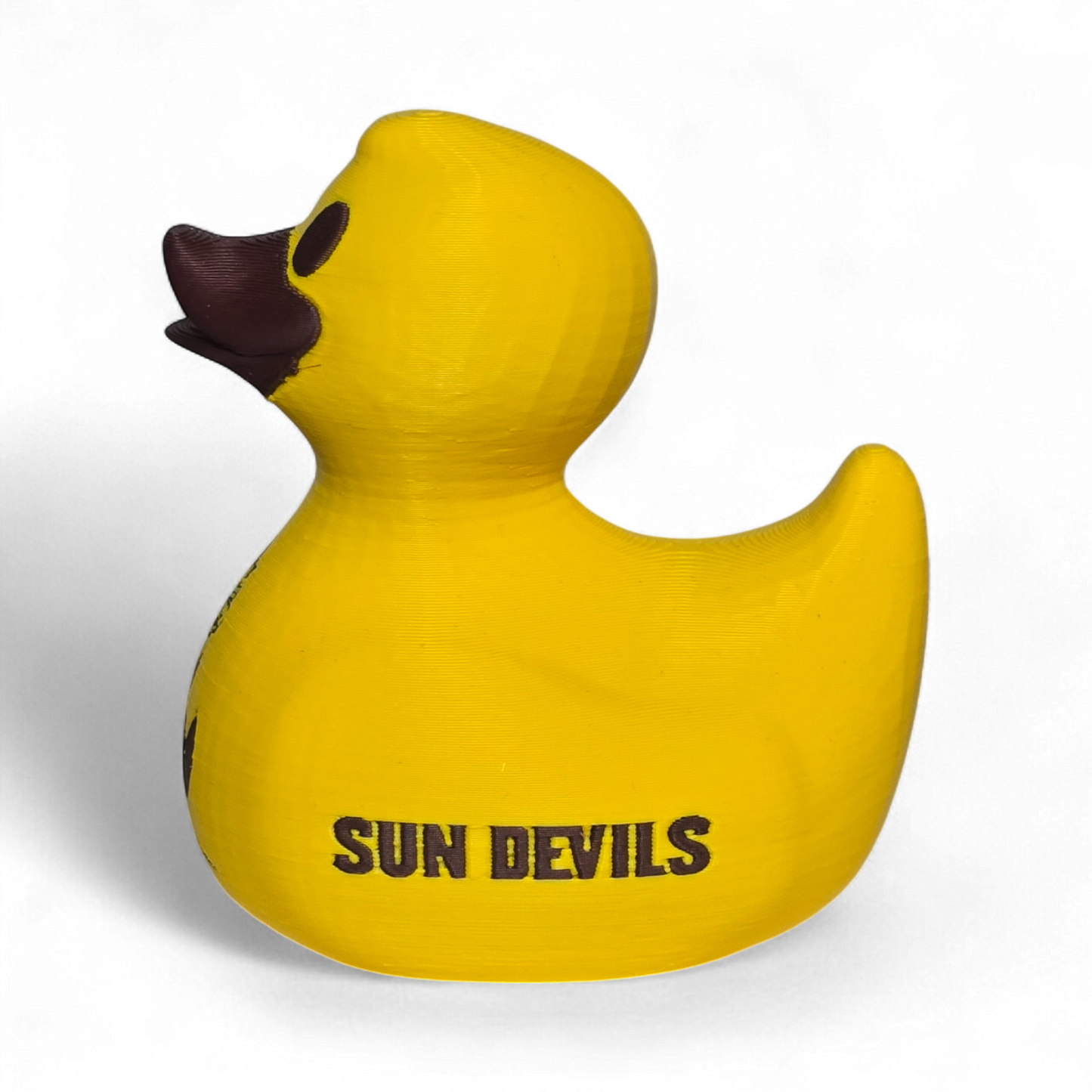 A bright yellow 3D printed PLA duck featuring the black 'SUN DEVILS' text and a cartoon devil graphic on its side, set against a plain white background.