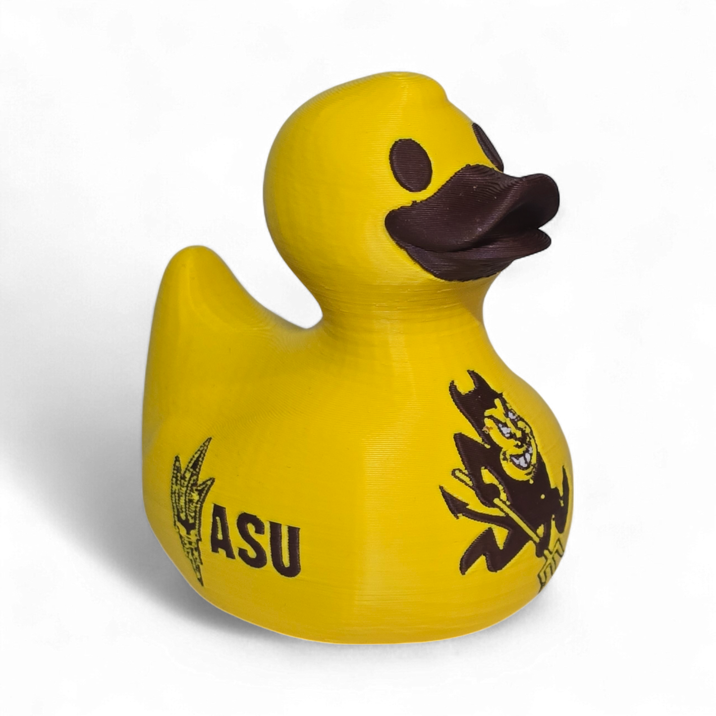 A bright yellow 3D printed PLA duck featuring the black 'SUN DEVILS' text and a cartoon devil graphic on its side, set against a plain white background.