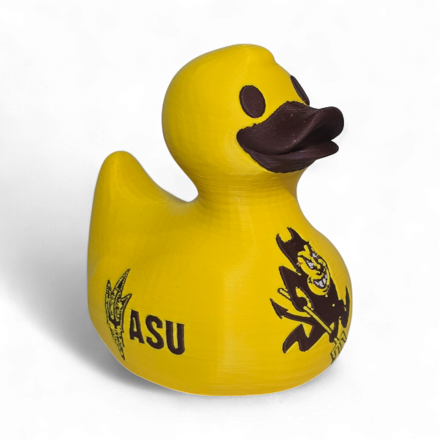 A bright yellow 3D printed PLA duck featuring the black 'SUN DEVILS' text and a cartoon devil graphic on its side, set against a plain white background.