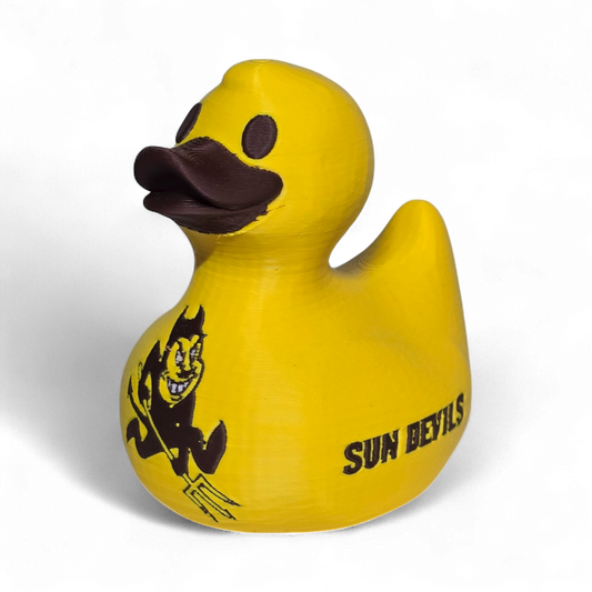 A bright yellow 3D printed PLA duck featuring the black 'SUN DEVILS' text and a cartoon devil graphic on its side, set against a plain white background.