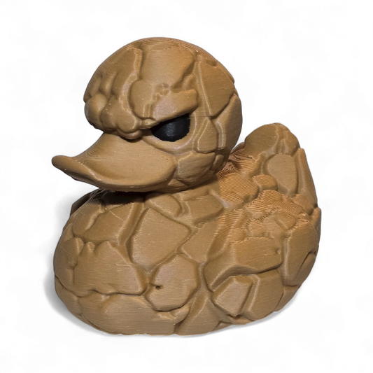 Brown 3D printed PLA duck with a textured surface on a white background