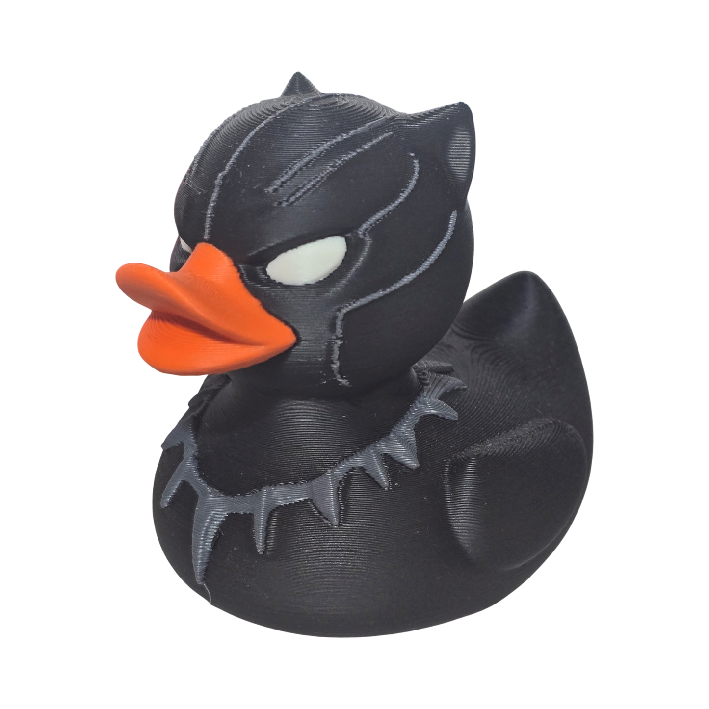 Black 3-d printed PLA duck with orange beak on a white background