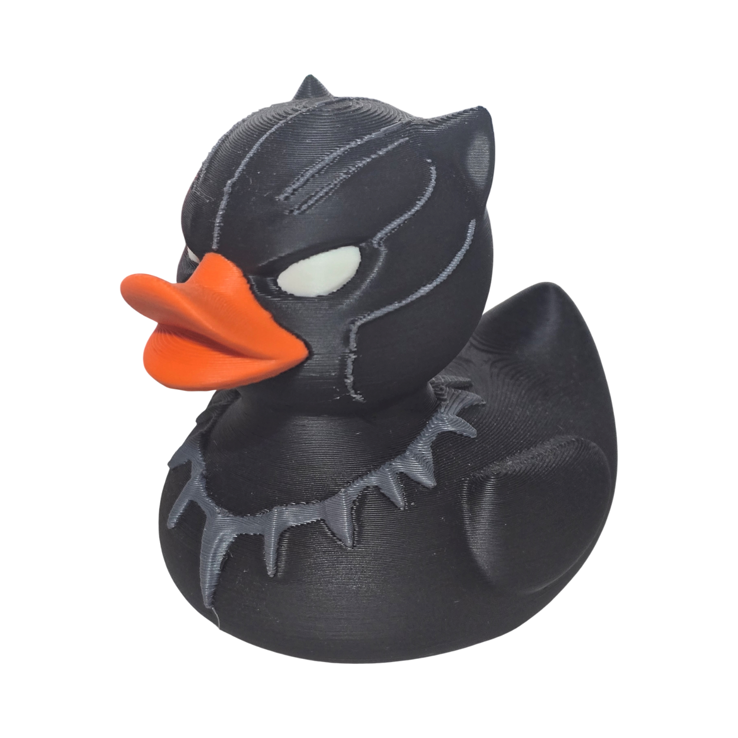 Black 3-d printed PLA duck with orange beak on a white background