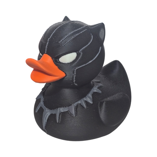 Black 3-d printed PLA duck with orange beak on a white background