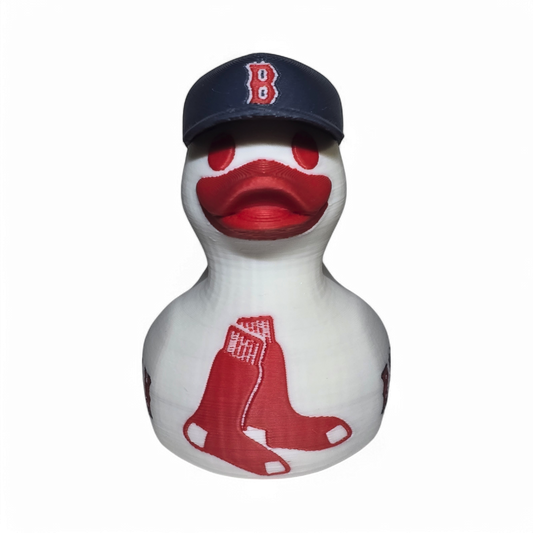 A white 3D printed PLA duck styled as a Boston Red Sox player, wearing a navy blue cap with a red 'B' logo and featuring red painted details and 'RED SOX' text on the side.