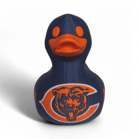 A navy blue 3D printed PLA duck with an orange beak and orange eye, featuring the Chicago Bears logo on the belly and the word 'BEARS' on the side, set against a plain white background.