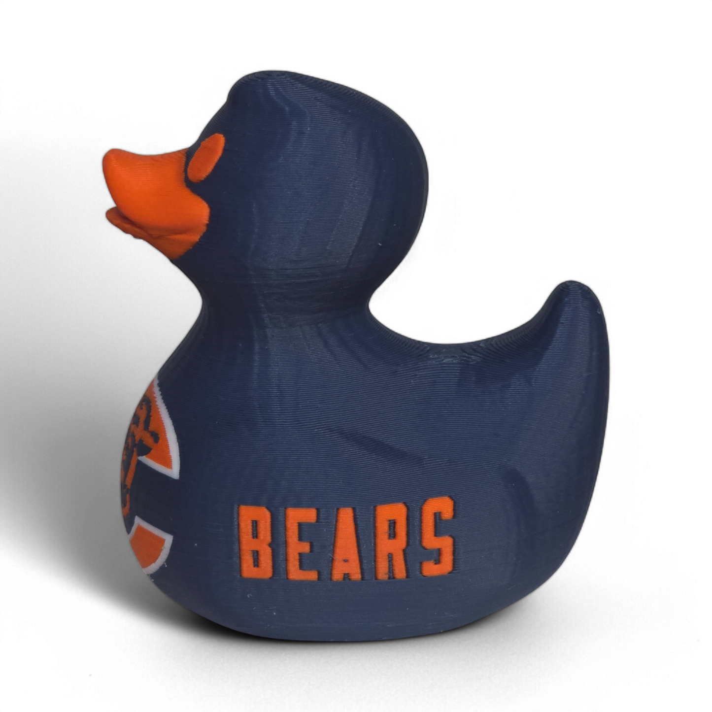 A navy blue 3D printed PLA duck with an orange beak and orange eye, featuring the Chicago Bears logo on the belly and the word 'BEARS' on the side, set against a plain white background.
