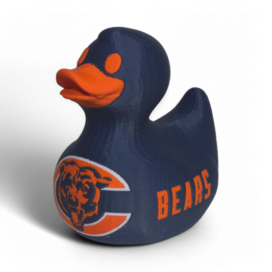 A navy blue 3D printed PLA duck with an orange beak and orange eye, featuring the Chicago Bears logo on the belly and the word 'BEARS' on the side, set against a plain white background.