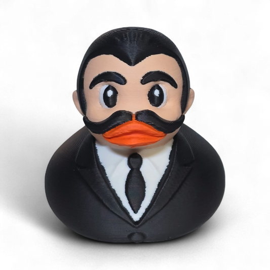 3D printed PLA duck with a formal outfit and mustache on a white background