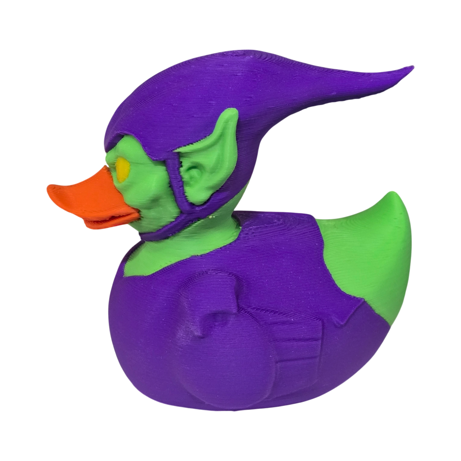 A 3D printed duck styled as the Marvel character Green Goblin, featuring a purple body and helmet, green skin, and an orange beak, isolated on a white background.