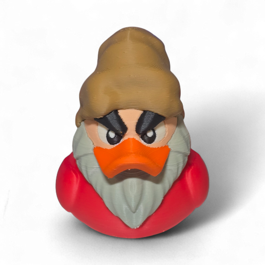 A 3D-printed figurine of a duck character resembling Grumpy, featuring a brown hat, orange beak, gray beard, and a red body, shown on a white background.