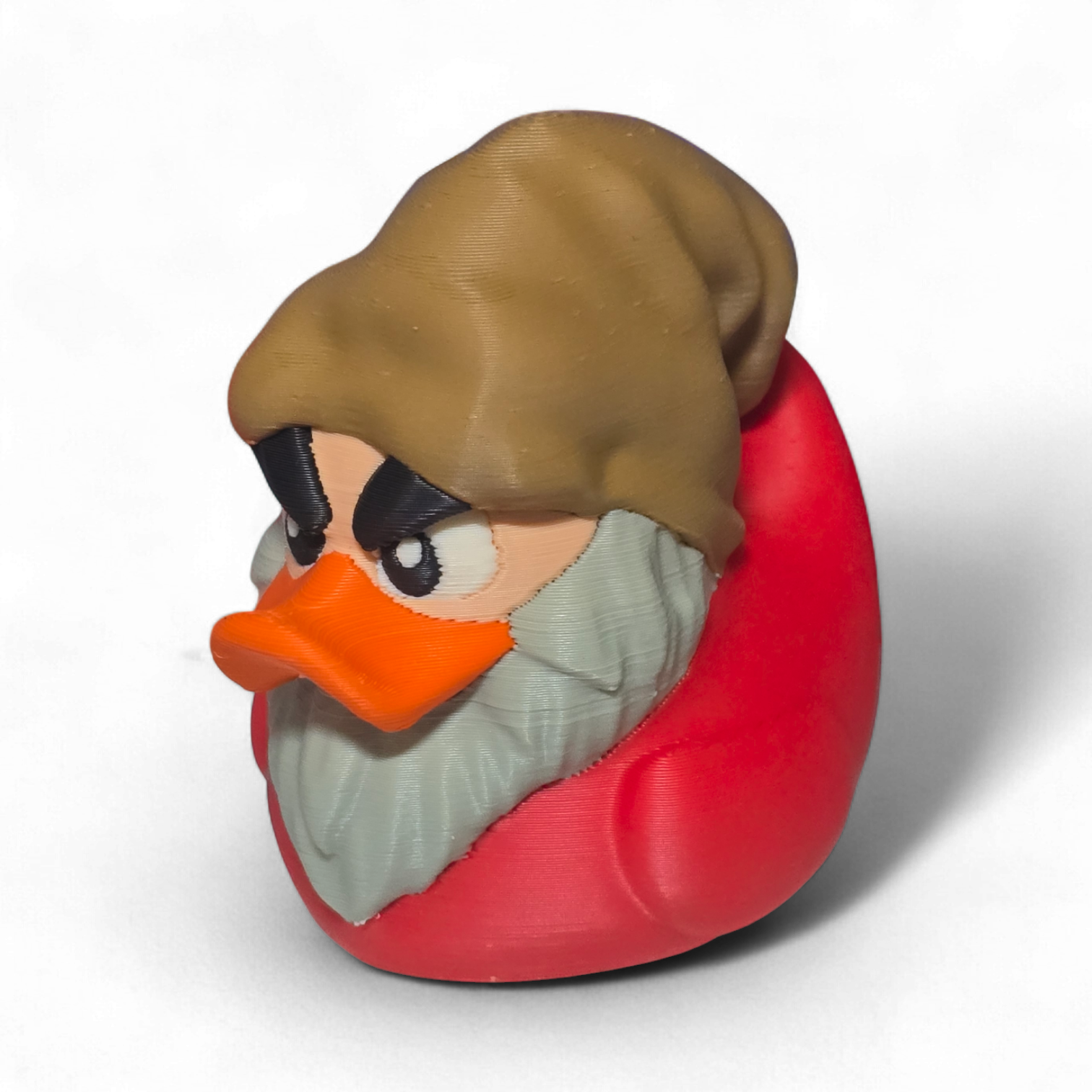 A 3D-printed figurine of a duck character resembling Grumpy, featuring a brown hat, orange beak, gray beard, and a red body, shown on a white background.
