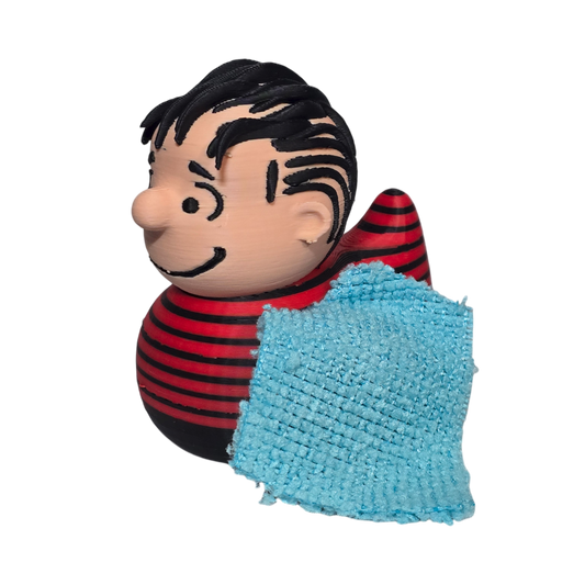 A Peanuts character 3D Printed PLA Duck with black hair, a red and black striped shirt, and a light blue textured blanket, shown on a plain white background.