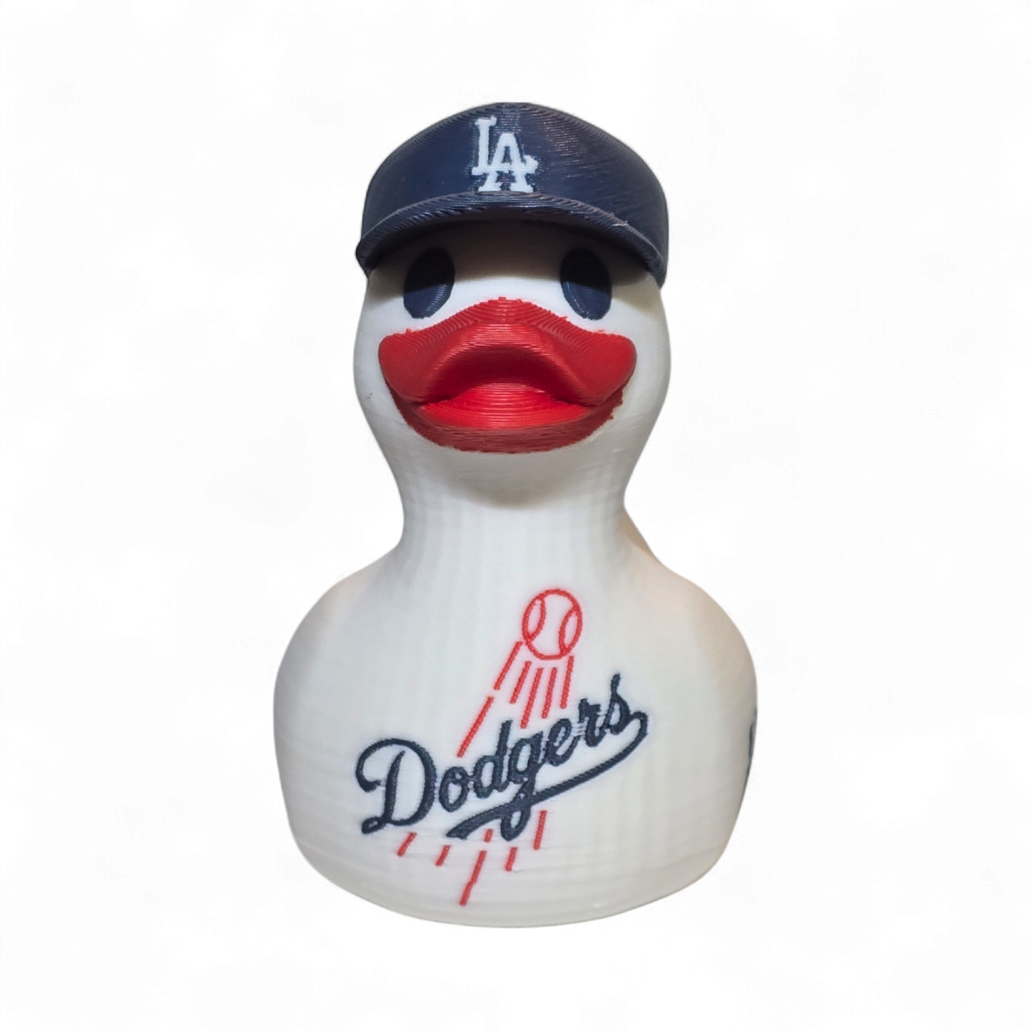 A white 3D printed PLA duck styled as a Los Angeles Dodgers player, featuring a navy blue cap with a white 'LA' logo, a red beak, and navy and red 'Dodgers' and 'ANGELES' graphics on its body, set against a plain white background.