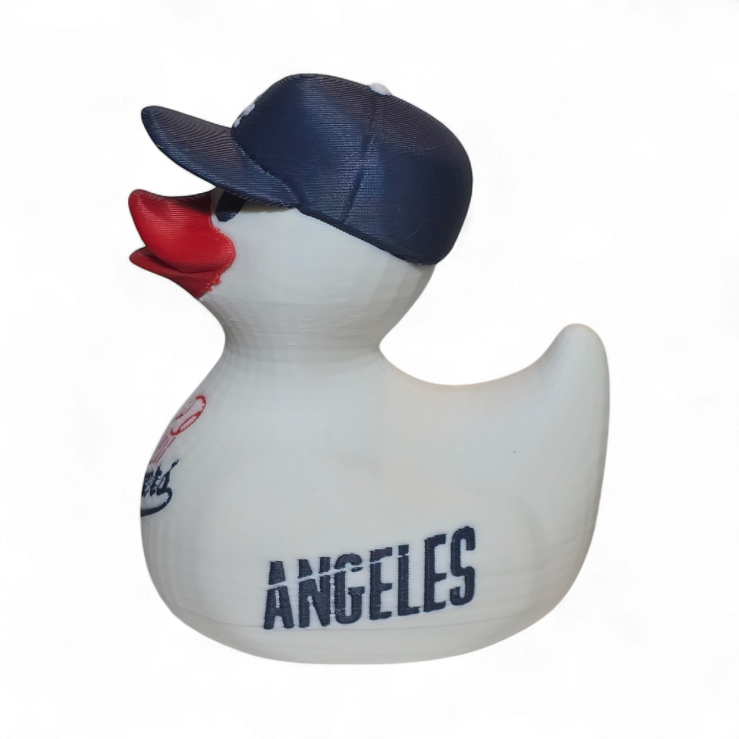 A white 3D printed PLA duck styled as a Los Angeles Dodgers player, featuring a navy blue cap with a white 'LA' logo, a red beak, and navy and red 'Dodgers' and 'ANGELES' graphics on its body, set against a plain white background.