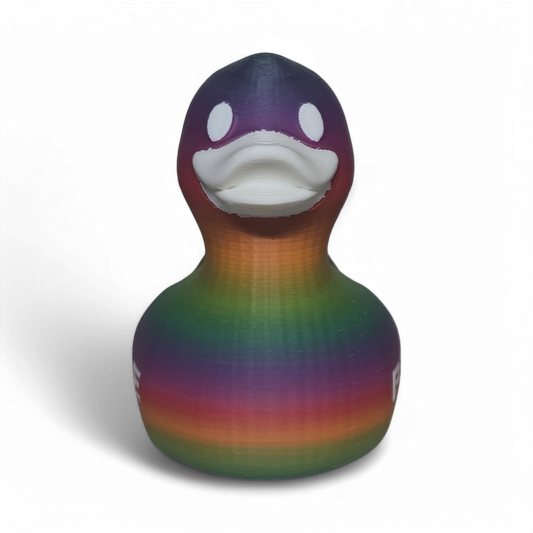 A 3D-printed PLA duck toy featuring a vibrant rainbow gradient pattern with the word 'PRIDE' printed in white on its side, set against a plain white background.