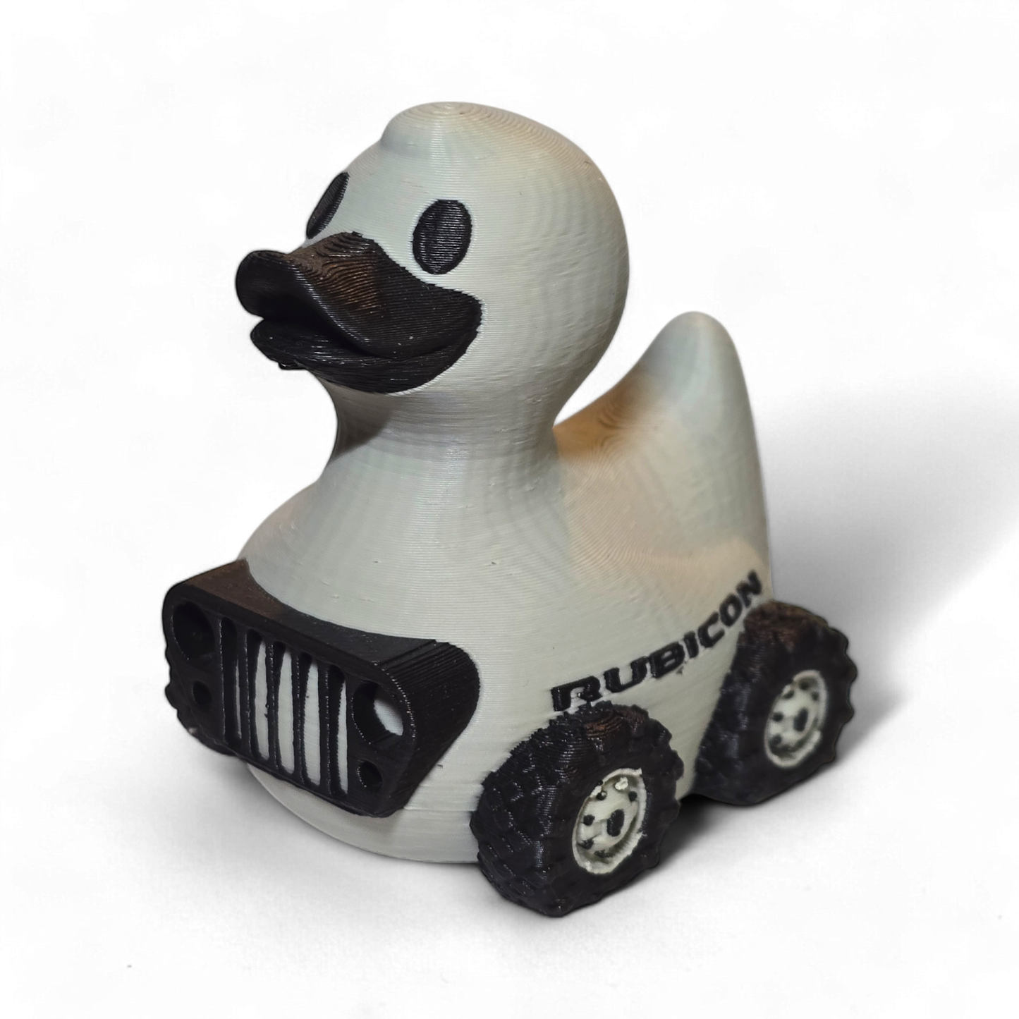 Rubicon-themed duck toy with a white body, black accents, and 'Rubicon' branding on a white background.