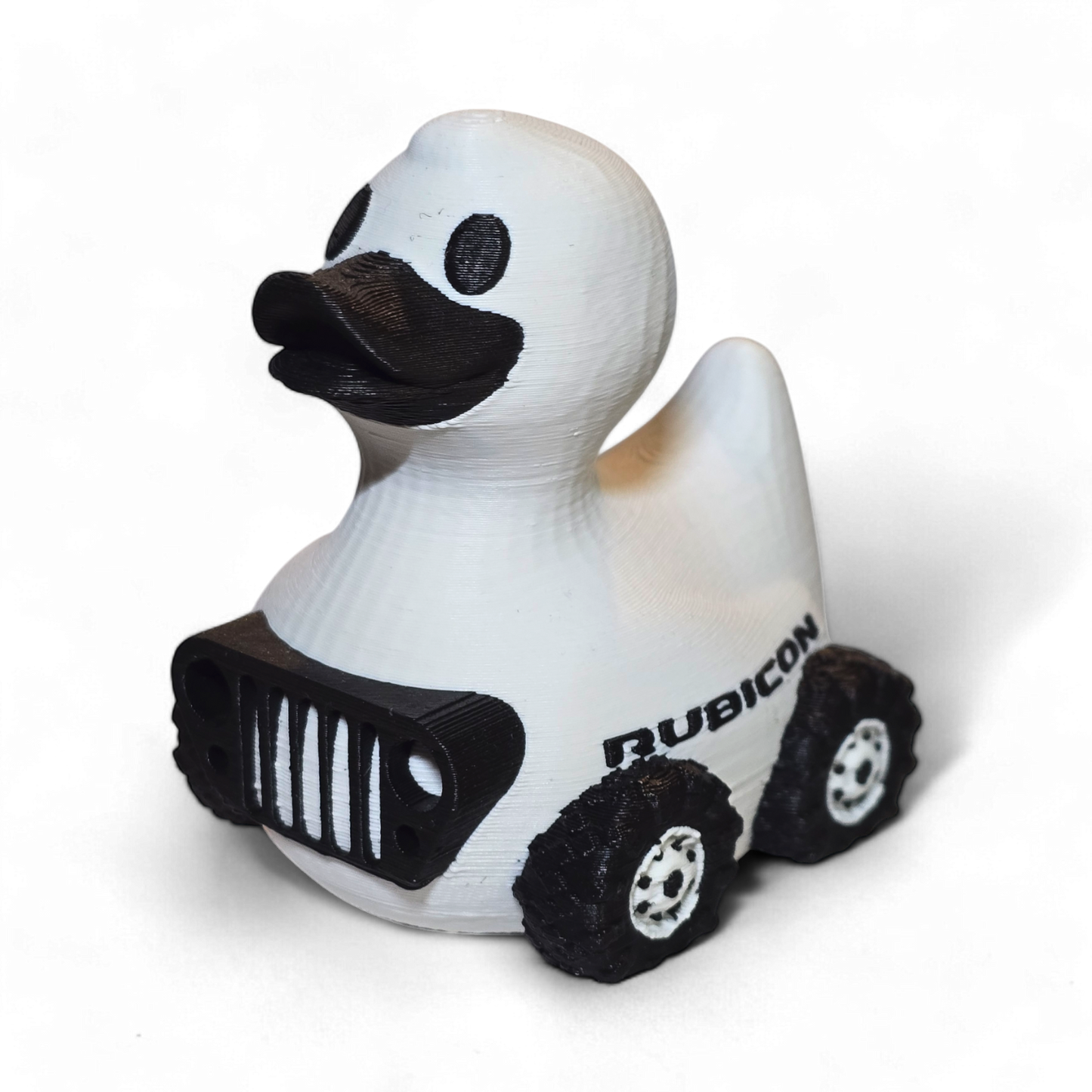3D printed duck shaped like a Jeep Rubicon on a white background