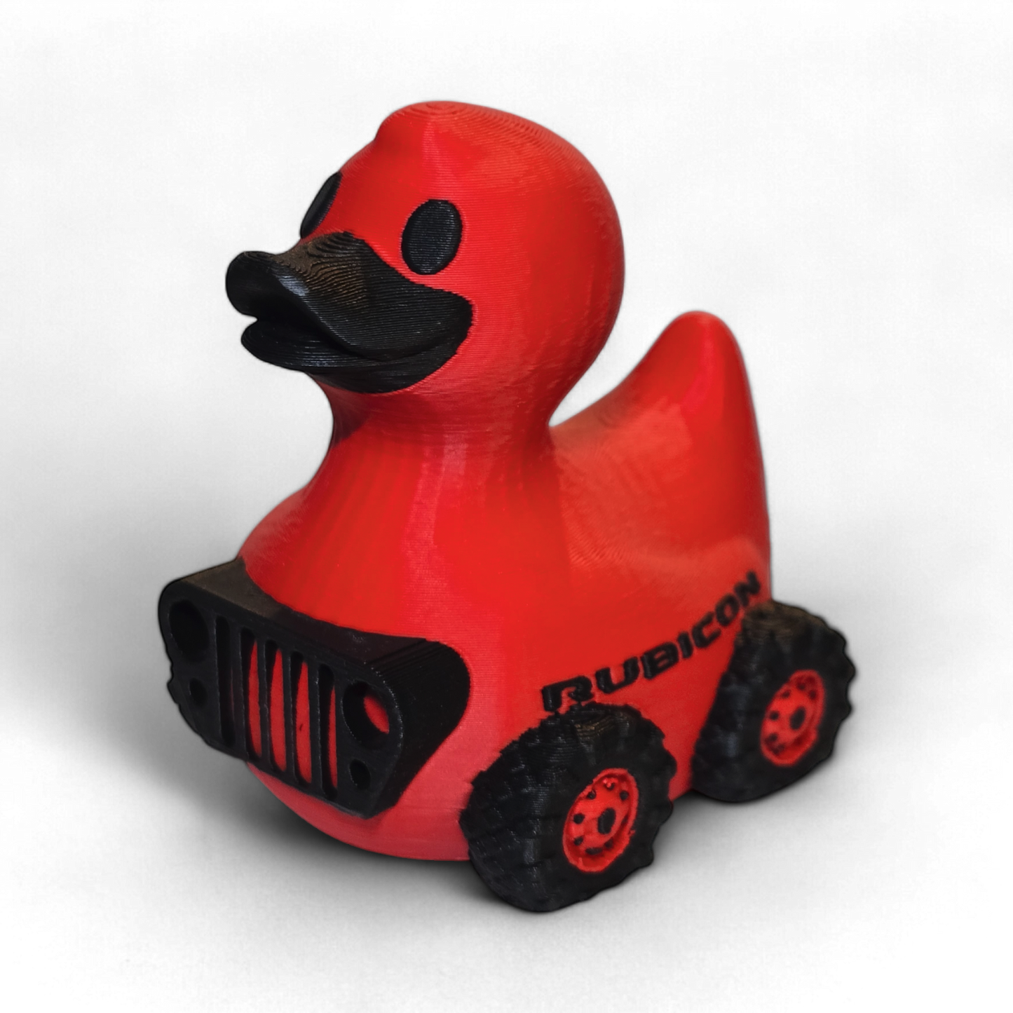Red 3D printed duck with black details and 'Rubicon' branding on a white background