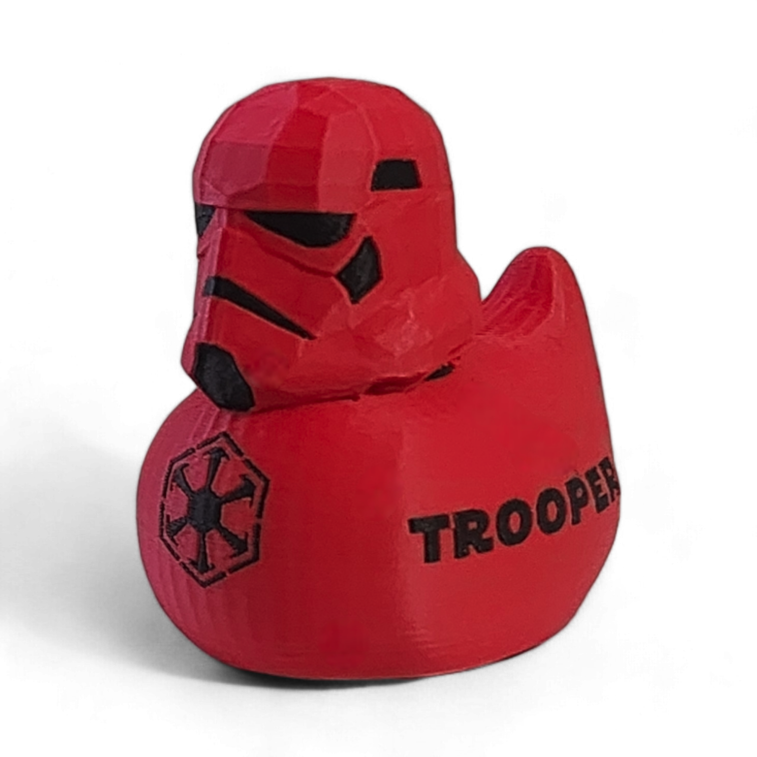 Red 'Trooper' duck toy with helmet on a white background