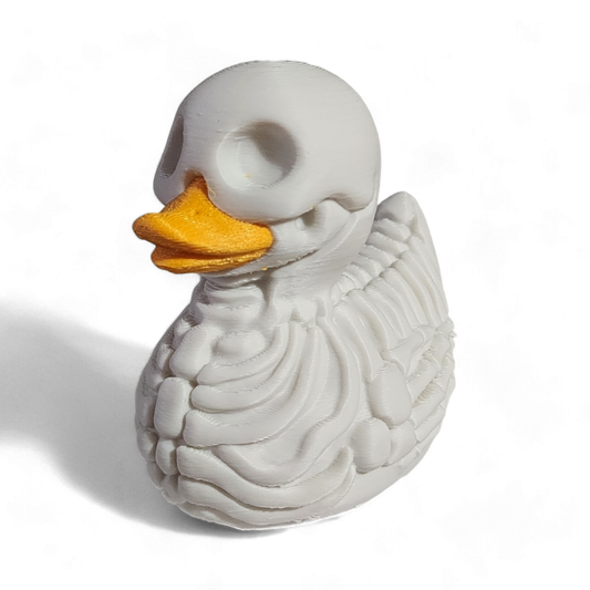 A white 3D printed PLA duck styled as a skeleton, featuring a hollowed-out head, exposed rib details, and a bright yellow beak, shown on a white background with a soft shadow.