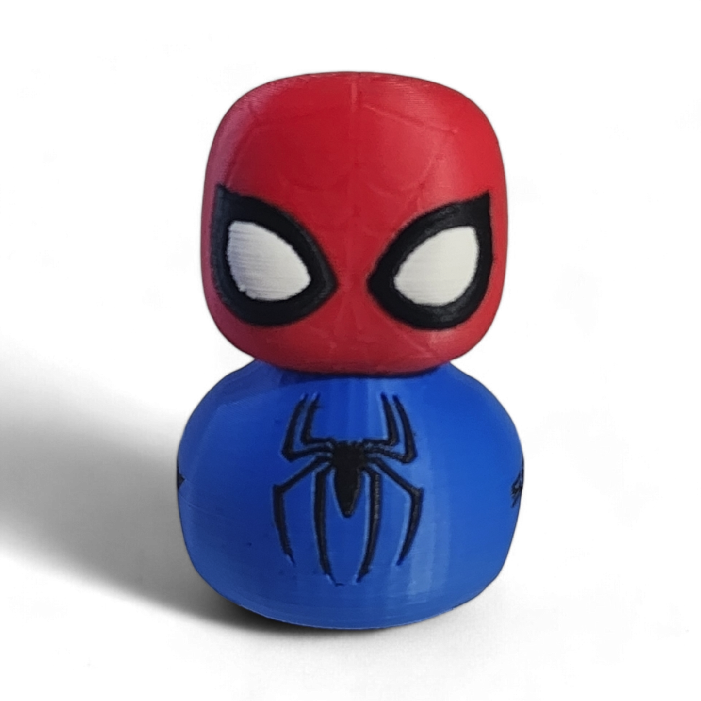 A Spider-Man-themed 3D printed PLA duck, featuring a red head with black and white eyes and a blue body with a black spider emblem and the word 'SPIDEY' printed on it, set against a plain white background.