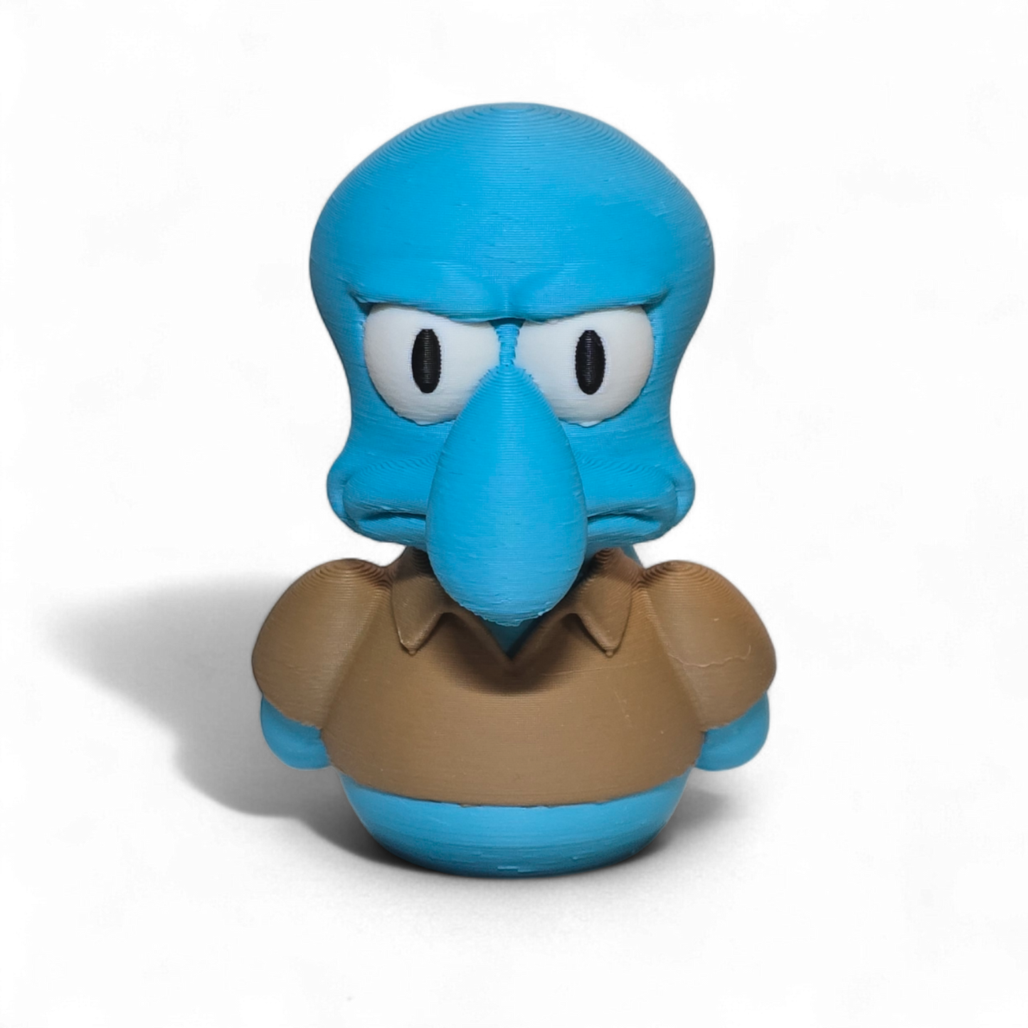 Blue cartoon character with a brown shirt on a white background