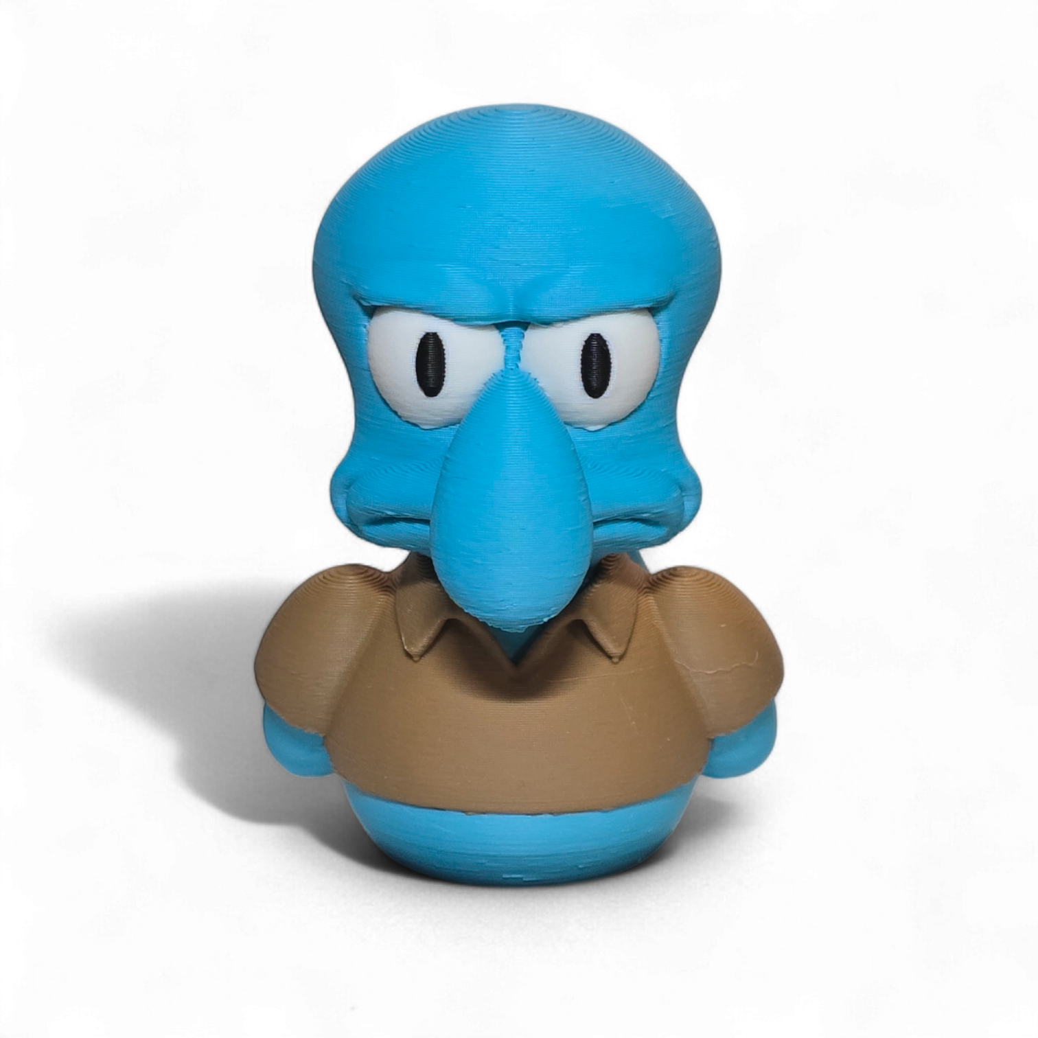 Blue cartoon character with a brown shirt on a white background