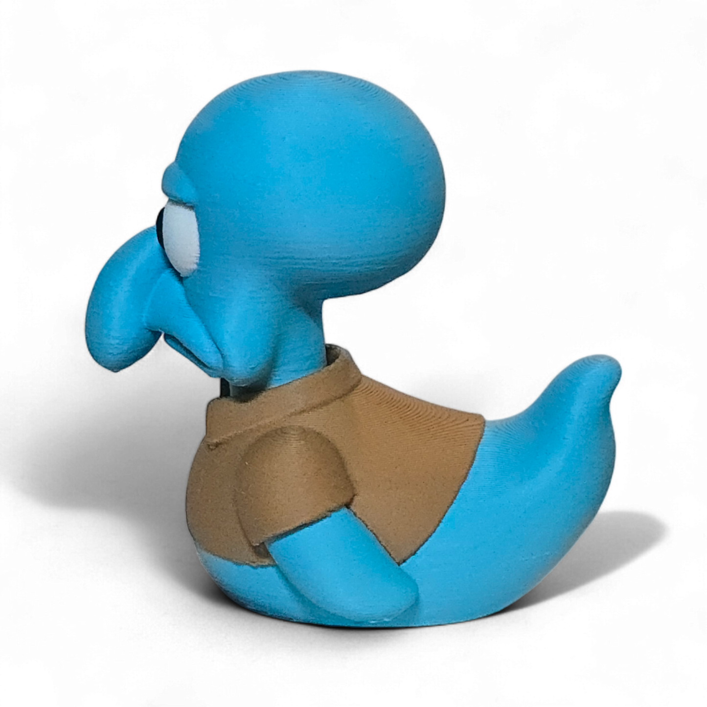 Blue 3D printed duck with a brown shirt on a white background