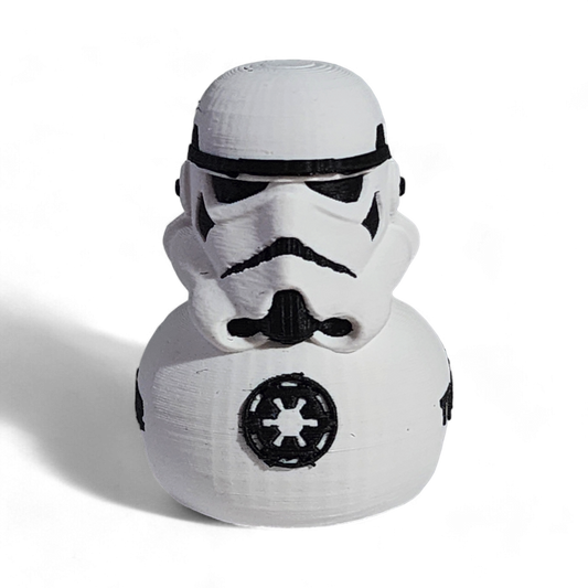 A white 3D printed PLA duck shaped like a Stormtrooper helmet, with black printed details including the Imperial crest and the word 'TROOPER' on the side, shown on a white background.