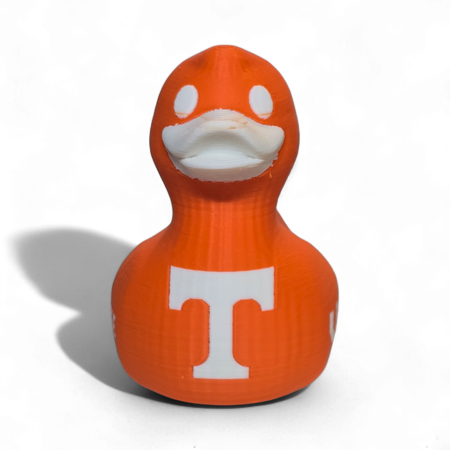 An orange 3D-printed PLA duck toy featuring the Tennessee Volunteers logo with a large white 'T' on the side and 'VOL' printed in white on the back, set against a plain white background.