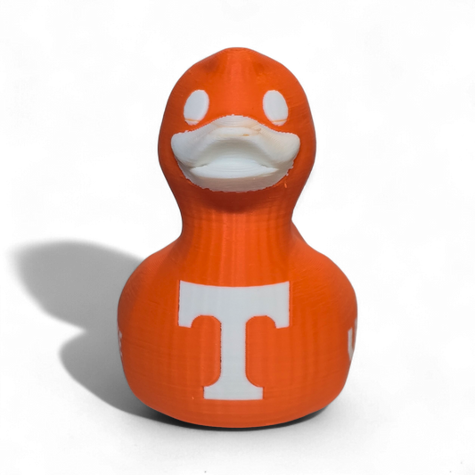 An orange 3D-printed PLA duck toy featuring the Tennessee Volunteers logo with a large white 'T' on the side and 'VOL' printed in white on the back, set against a plain white background.
