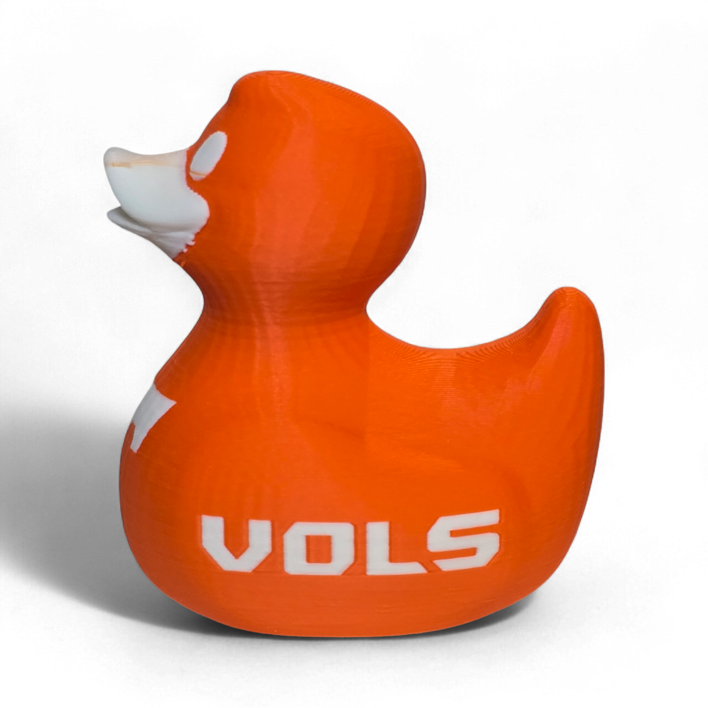 An orange 3D-printed PLA duck toy featuring the Tennessee Volunteers logo with a large white 'T' on the side and 'VOL' printed in white on the back, set against a plain white background.