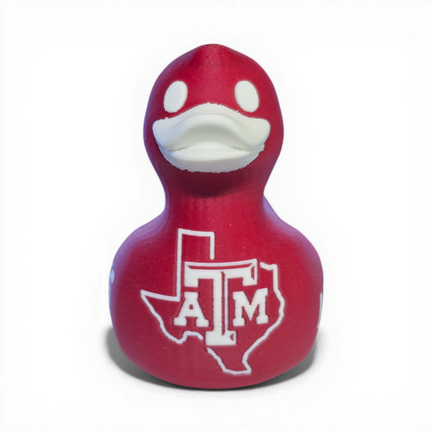 Red 3D printed PLA duck with Texas A&M logo on a white background