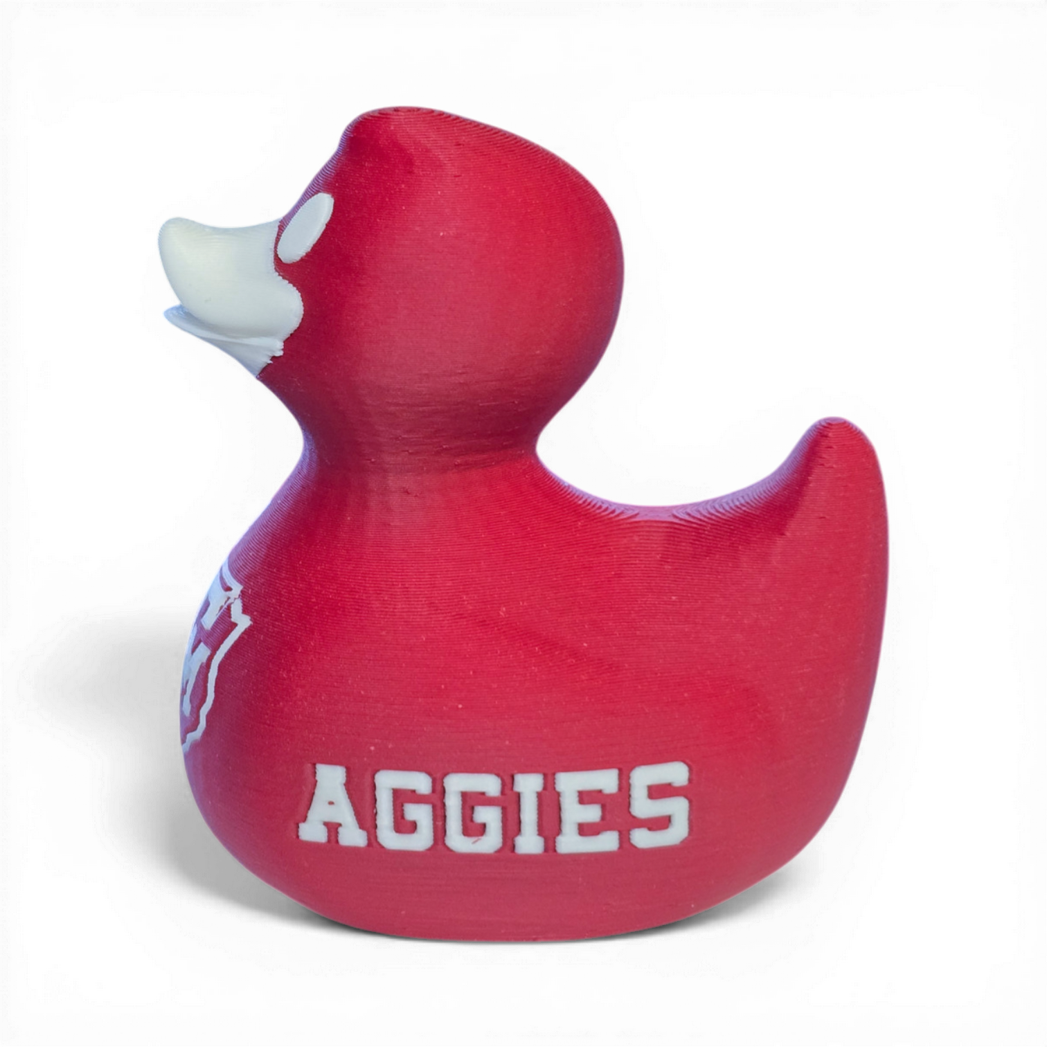 Red 3D printed PLA duck with Texas A&M logo on a white background
