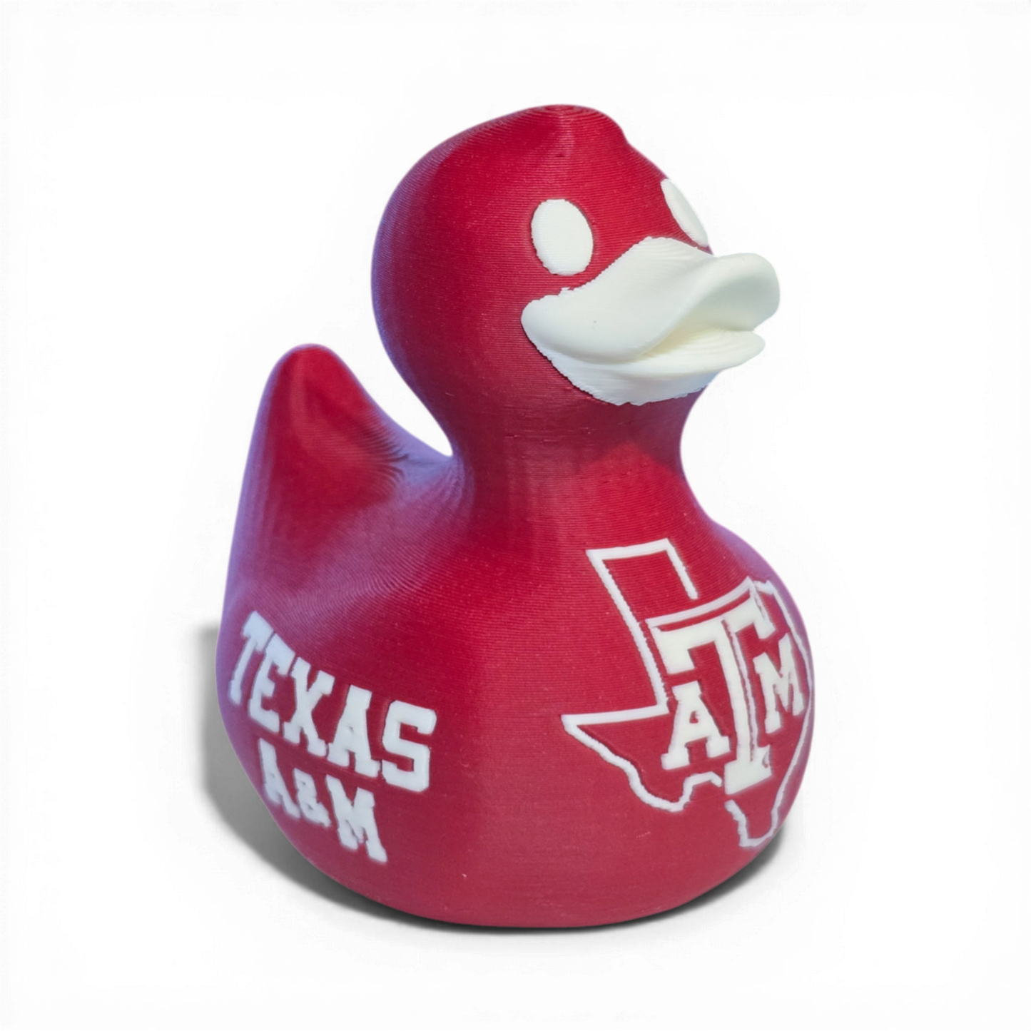 Red 3D printed PLA duck with Texas A&M logo on a white background
