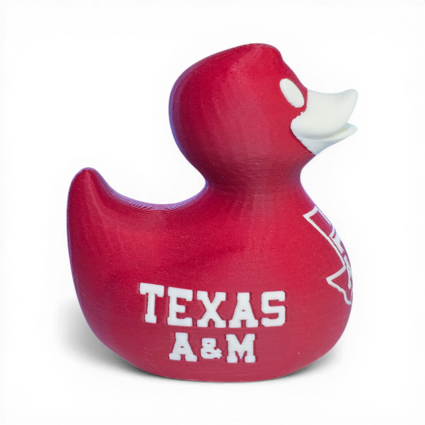 Red 3D printed PLA duck with Texas A&M logo on a white background