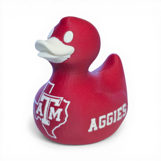 Red 3D printed PLA duck with Texas A&M logo on a white background