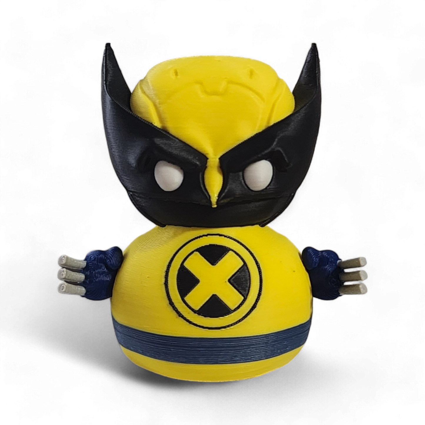 A small Wolverine figurine or toy in a bright yellow costume with black mask, blue accents, and white claws, photographed on a plain white background.