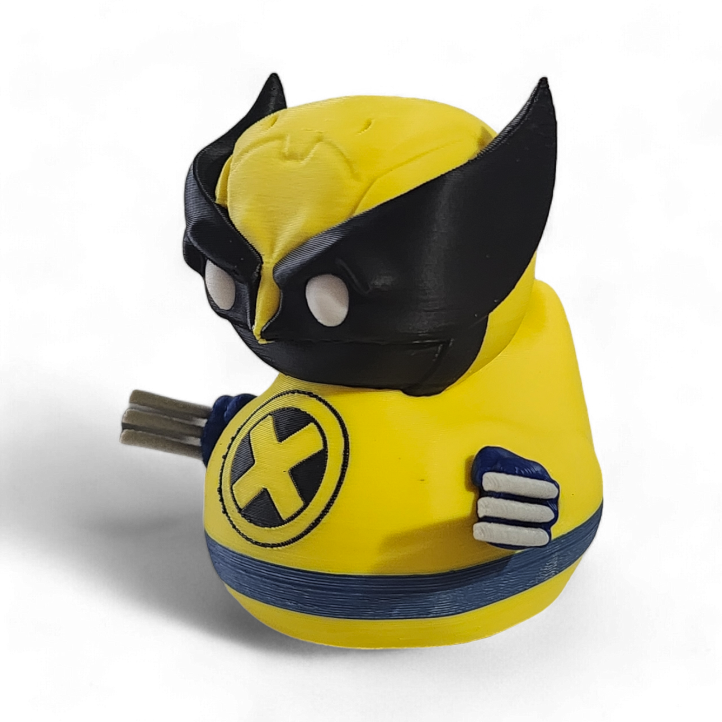 A small Wolverine figurine or toy in a bright yellow costume with black mask, blue accents, and white claws, photographed on a plain white background.