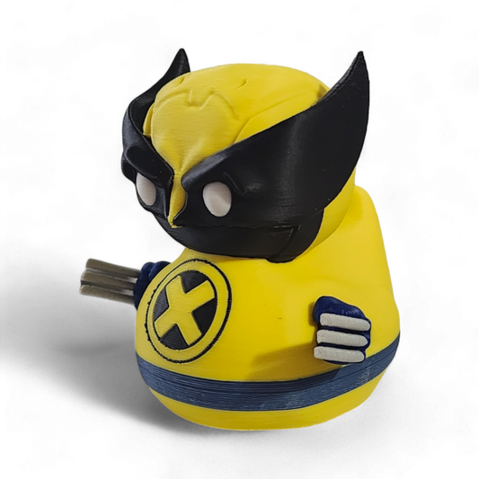 A small Wolverine figurine or toy in a bright yellow costume with black mask, blue accents, and white claws, photographed on a plain white background.