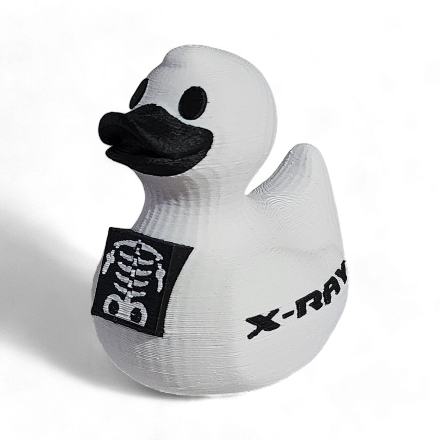 White 3D printed PLA duck with black skeleton design and 'X-Ray' text on a white background