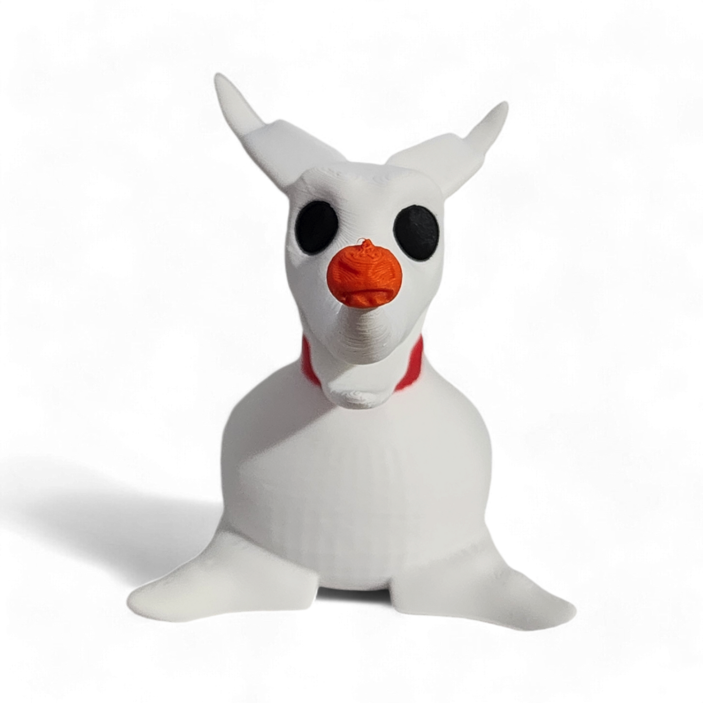 White plush toy with black eyes and an orange nose on a white background
